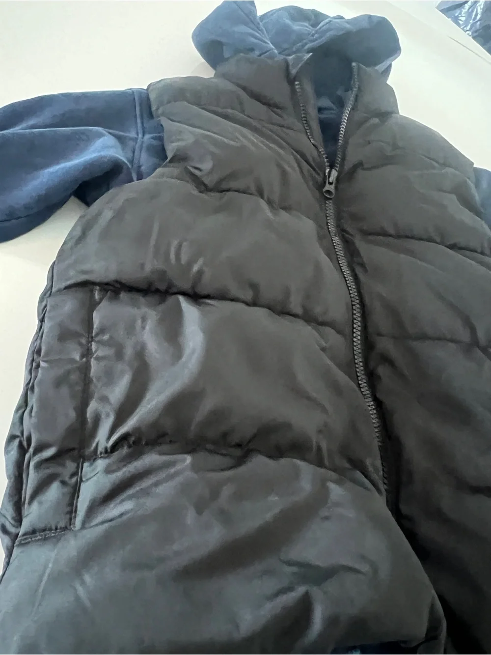 Old Navy Kids Black Puffer Vest with H&M Blue Hoodie together for a Layered Look